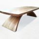 Ceeder wooden coffee table with curved base and top with ends curved